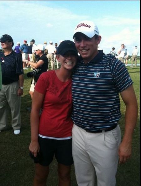 Scott Stallings in a black t-shirt poses with his partner Jennifer White.